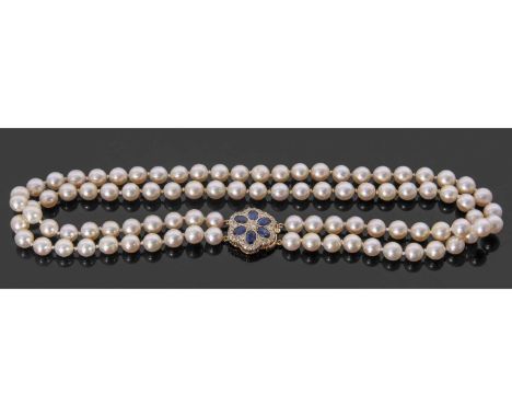 Double row cultured pearl necklace with a large gold, sapphire and diamond clasp, two rows of uniform beads, 7.35mm each appr