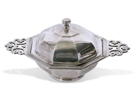 Heavy quality George V muffin dish of octagonal form with pierced side handles, having a domed lid with boss finial lifting t