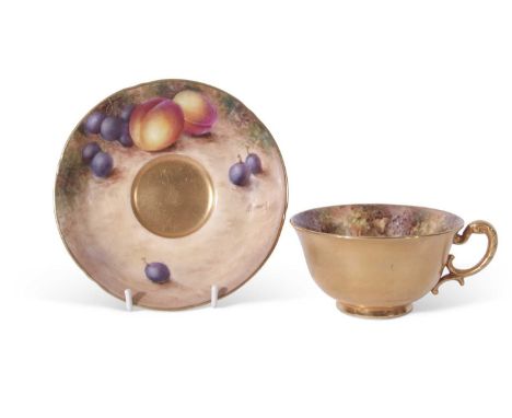 Royal Worcester cup and saucer, finely painted with fruit by Freeman, black mark to base, saucer 14cm diam