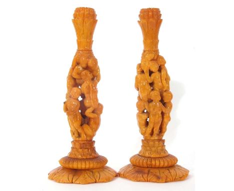 Pair of mid 19th century natural Baltic amber candlesticks (possibly German), having Corinthian style capitals, the columns c