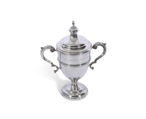 George V silver trophy cup of standard form with raised body band, leaf capped double C scrolled hollow handles, the push-on 