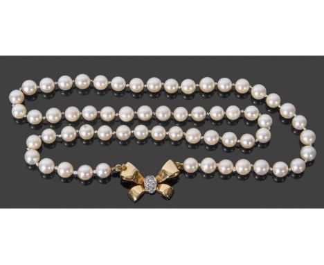 Cultured pearl necklace, a single row of cultured pearls of uniform shape, 6.7mm each approx, to a 750 stamped diamond set ti