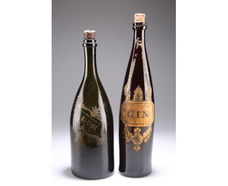 TWO 19TH CENTURY BROWN GLASS WINE BOTTLES, the first of slender tapering form, labelled 'GIN', 33cm; the second mallet-shaped