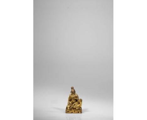 Bronze fire-giltChina / Tibet , 17th centuryDimensions: 8 x 5 x 3,5 cmWeight: 302 gramsSeated astride his goat reclining on a