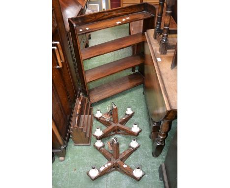 An oak open shelf four tier waterfall bookcase; two oak ceiling lamps; an oak magazine rack; an oak standard lamp. (4)