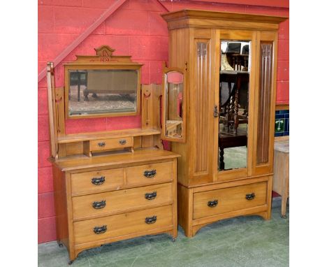 An early 20th century satinwood wardrobe, outswept cornice, mirrored door flanked by carved panelling, deep drawer to base, A