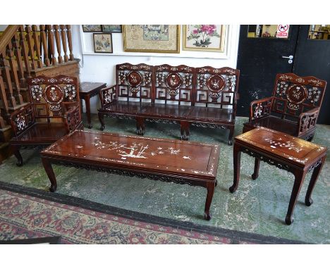 A Chinese eight piece sitting room suite, comprising four armchairs, three seat sofa, low coffee table and a pair of side tab