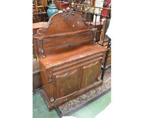 A Victorian mahogany chiffonier, shaped pediment, shelf and turned columns to the superstructure, long drawer over two door c