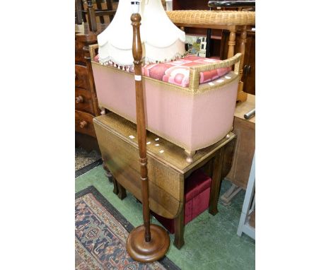 A 1940's oak dropleaf table with reeded legs; four oak dining chairs. a Lloyd Loom style ottoman; a padded footstool; an oak 