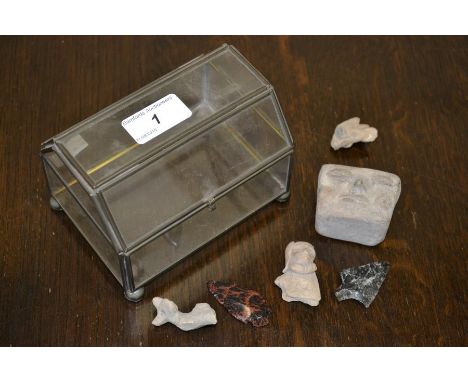 A collection of pre-Colombian pottery artefacts and arrow heads