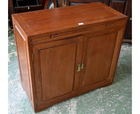 An oriental bachelor's cupboard, caddy top, brushing slide, two fielded panel doors enclosing three drawers and adjacent shel