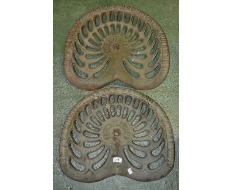 A pair of Baker & Hamilton of Sacramento cast iron tractor seats (2)