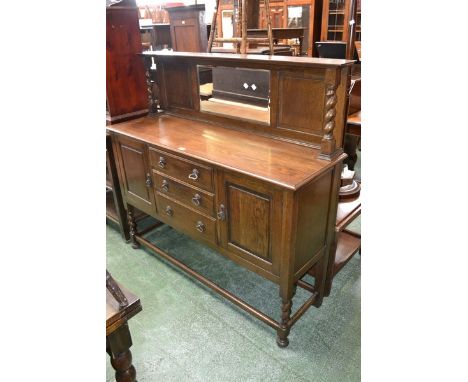 A 1940's oak sideboard, shelf with barley twist supports and mirror to the gallery. moulded top, three graduated drawers flan