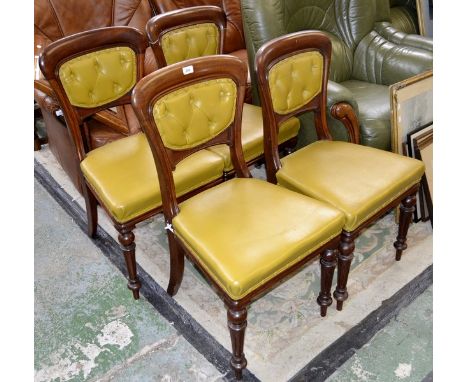 Four Victorian mahogany dining chairs, leather button back, padded seat, turned and fluted forelegs.