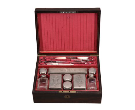  An early Victorian rosewood toilet box with silver fittings by Francis Douglas, London 1841, with nine silver lidded bottles