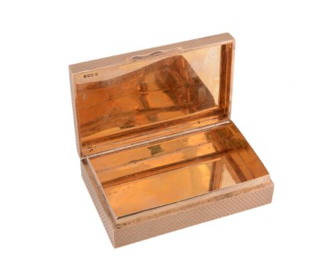  A 9 carat gold rectangular pocket box by S. J. Rose & Son, London 1957, engine turned overall, the cover with a raised husk 