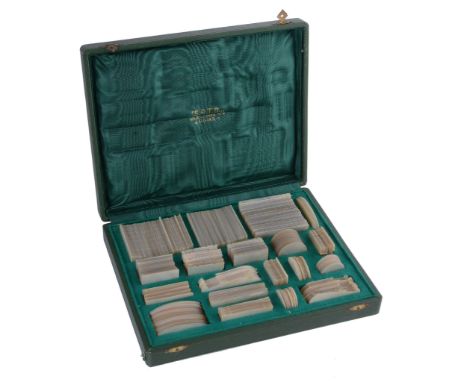  A collection of Chinese mother of pearl gaming counters, 19th century, variously engraved, comprising: 34 fish, 36 navette, 