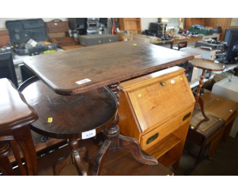 A small side table raised on tripod base and one other table