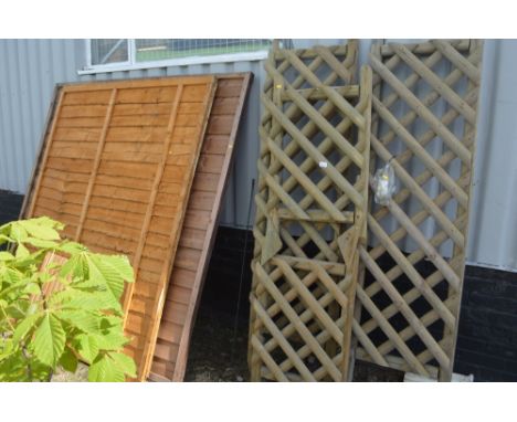 A garden arch; two fence panels; and a pine step 