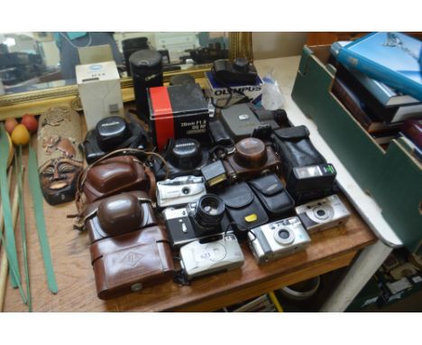 A large quantity of various cameras to include Canon; Zenit; Olympus and Minolta etc