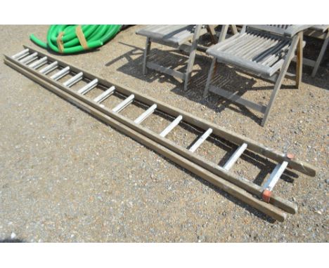 A wooden and metal extending ladder