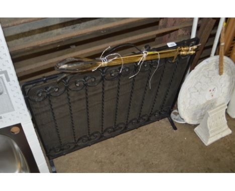 A fire screen and irons