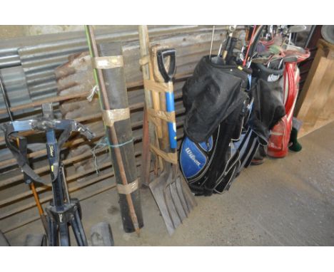 A bundle of long handled gardening tools; together with a roll of felt etc