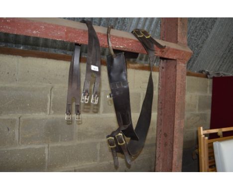 A handmade English leather girth and an English leather anti cast roller