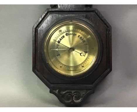 ANEROID BAROMETER WITH THERMOMETER contained in an oak case