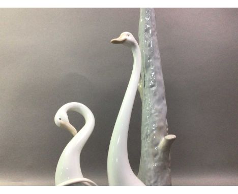 NAO FIGURAL TABLE LAMP WITH ANOTHER LAMP AND A FIGURE the first lamp modelled with two geese, and a Lladro figure55cm high Qt