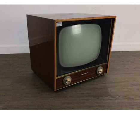 VINTAGE DEFIANT TELEVISION IN A MAHOGANY CASE complete with dials, and makers name to front47cm high x 48cm wide x 43cm depth