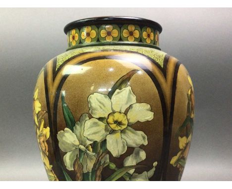 DOULTON LAMBETH VASE LATE 19TH CENTURY decorated with daffodils and other flowers, impressed marks31cm highLarge chip to rim,