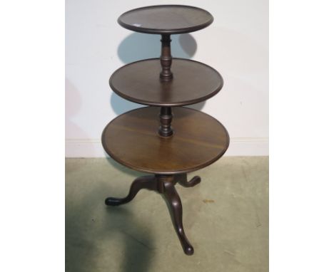A 19th Century three tier mahogany circular dumb waiter on a tripod base, 111cm tall, 63cm diameter, tapering to 39cm diamete