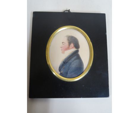 A regency portrait miniature of a gentleman wearing a blue coat, watercolour on card, faintly initialled and dated - T S H 18