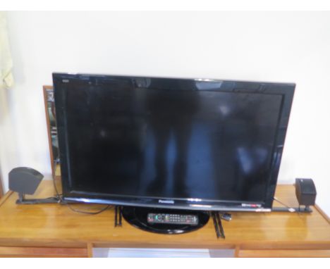 A Panasonic flat screen TV, model TX-L37510B with 2 bose speakers 