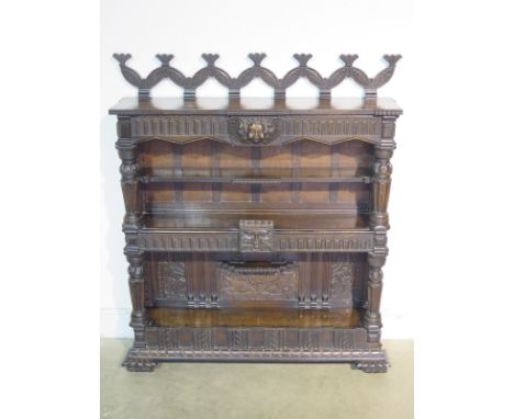 An antique and later oak and walnut carved book case, with an adjustable shelf - 130cm H x 110cm x 29cm 