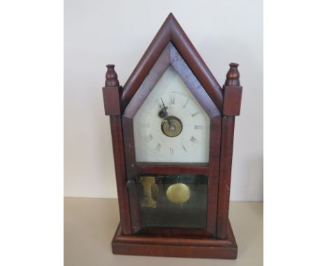 An American Gothic mahogany 36 hour mantle clock, 39cm tall, in running order, some wear to dial 