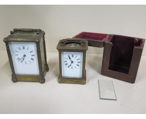 A brass carriage clock 14cm tall, small cracking to dial, chip to front glass, running - and another carriage clock, two glas