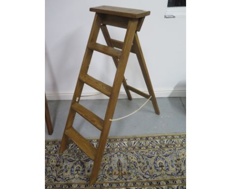 A vintage 4-tread step ladder, waxed for decorative use - 120cm long, in clean condition 