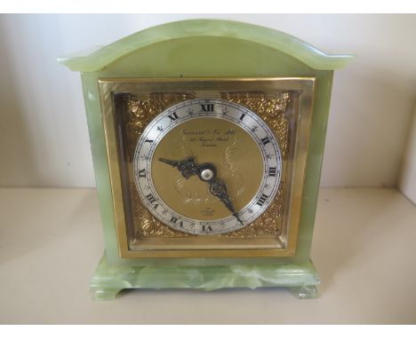A green onyx Elliott mantle clock retailed by Garrard &amp; co, 16cm tall, in clean working order 
