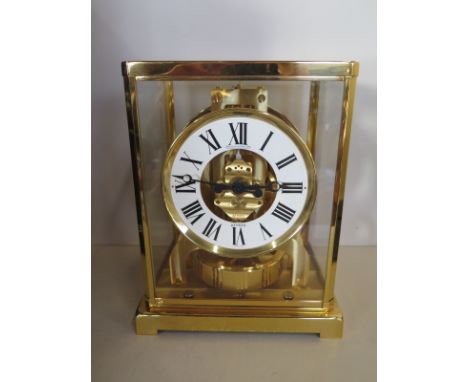 A Jaeger-le Coultre brass Atmos clock model 5833 G2/32 with original box and papers, bought in Harrods 8-12-83 in very good c