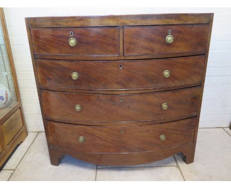 A Regency flame mahogany and inlaid chest with two short over three long drawers, on bracket feet - 108cm W x 54cm D x 106cm 