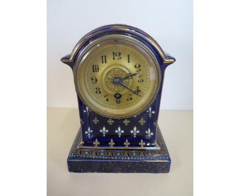 A blue glazed ceramic mantle clock with Fleur de Lys, decoration 20cm H 
