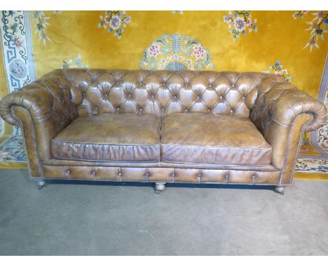 A Halo leather button back Chesterfield upholstered in distressed tan leather retails around £2,800 - 214cm wide 