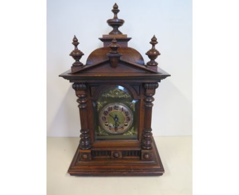 A 19th century walnut striking mantel clock, 50cm H, Arabic dial, with key, currently running in the saleroom 