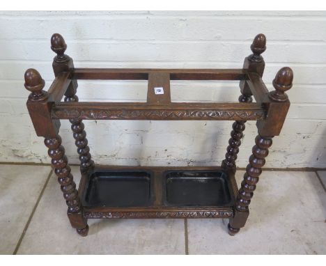 A bobbin turned stick stand with trays, 69cm H x 60cm x 25cm 