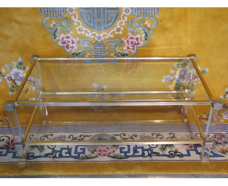 Pierre Vandel two tier table with lucite supports and outswept corners, bevelled glass top and glass shelf beneath 110cm W x 