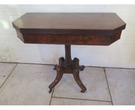 A 19th Century mahogany fold over card table 