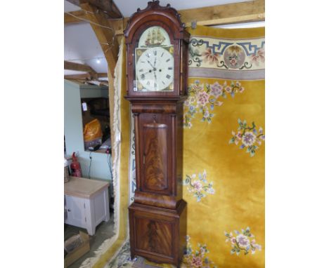 A Georgian mahogany longcase clock, the arched hood with C scroll surmount and turned pilasters flanking arch dial, signed Jo