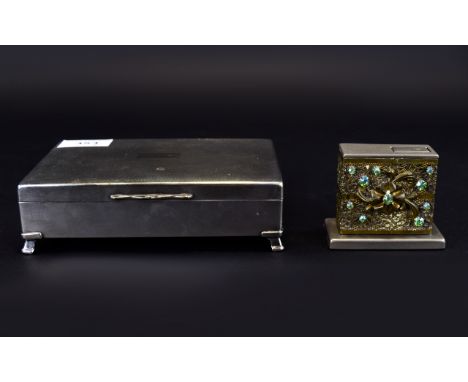 A Vintage Plated Cigarette Box And Tabletop Lighter Small footed cigarette box with machine turned textural finish and blank 